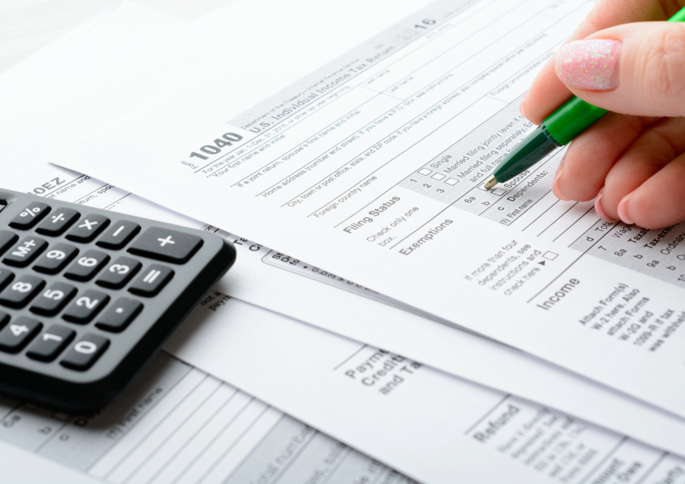 Tax preparation — 1040 form with calculator